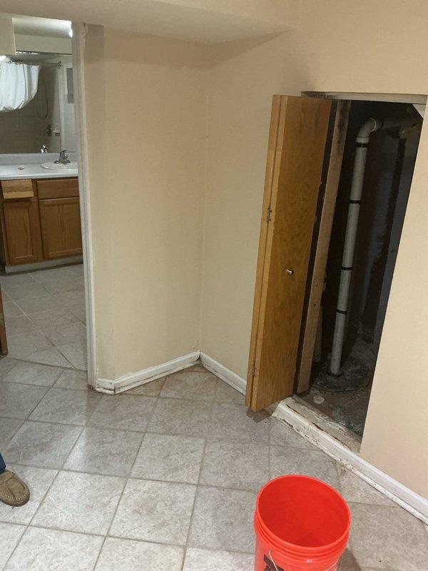 Completed assessment and sold repair for basement plumbing and HVAC system installation. Documented existing utility room configuration including furnace with QuickCURB installation platform, water heater, vertical PVC drainage piping with proper fittings and joints, and utility closet access with exposed plumbing infrastructure requiring service intervention. Down payment collected with scheduling arranged for complete repair execution.
