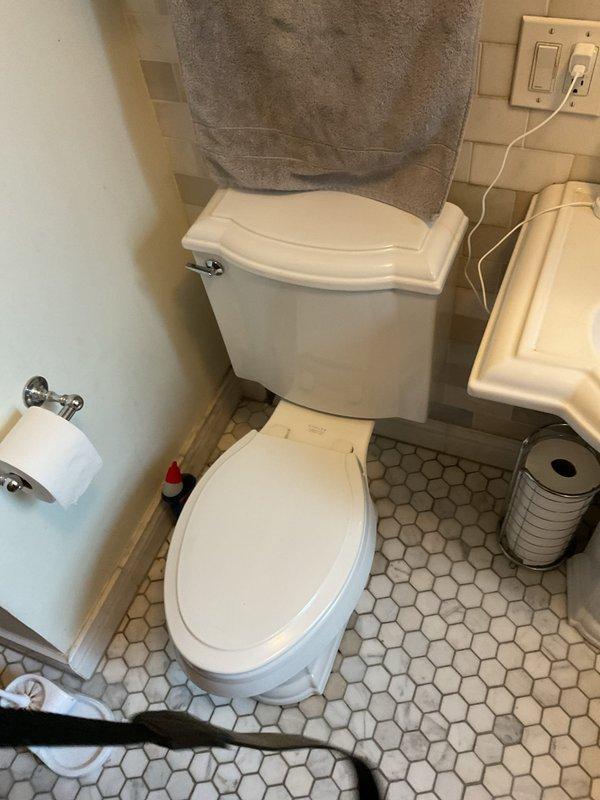 Completed toilet replacement in master bathroom on second floor. Removed existing two-piece toilet and installed new fixture, ensuring proper seal with new wax ring, secure floor bolting, and verified water supply connection. Tested for leaks and confirmed proper flush operation upon completion.