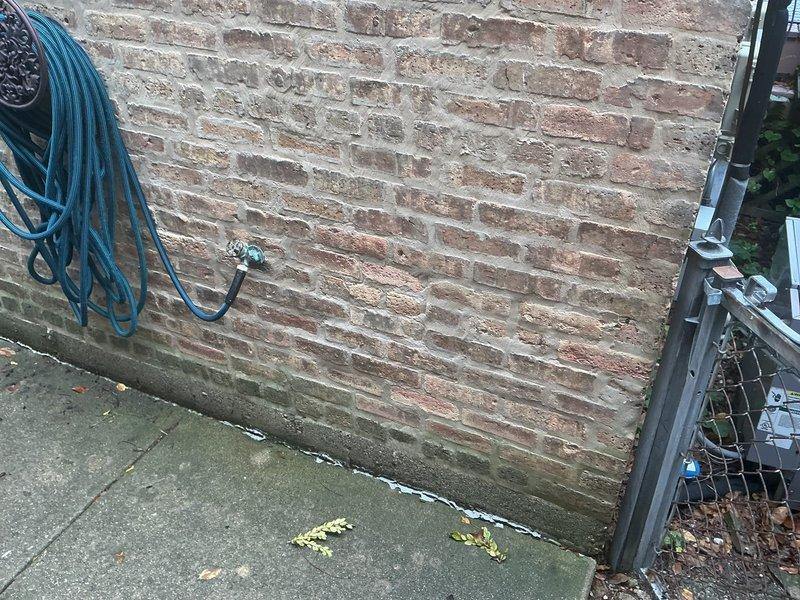 Responded to service call to locate existing water shut-off valves at residential property. Conducted thorough inspection of exterior and interior plumbing infrastructure, including examination of outdoor hose connections at brick wall perimeter and accessible piping in basement/crawl space area featuring copper supply lines and galvanized metal pipes. Provided estimate for installation of water shut-off valves as existing shut-offs could not be located on the property.