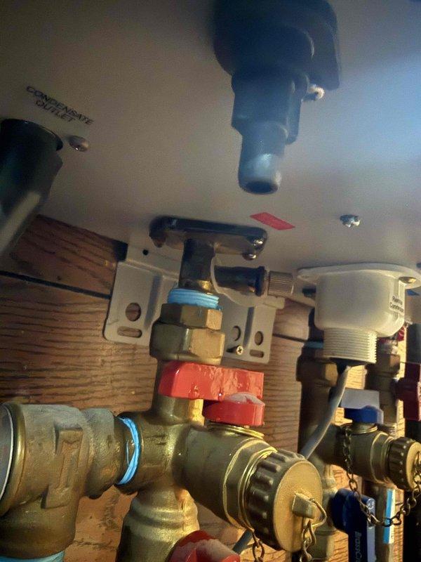 Responded to service call for Rheem tankless water heater malfunction. Upon inspection, found significant dust and debris accumulation in the unit's internal compartment affecting operational components. Performed thorough cleaning of heat exchanger assembly, burner chamber, and electrical connections. Inspected water supply lines, shut-off valves, and inlet filtration system for proper function. Verified all brass fittings, compression connections, and isolation valves were secure and leak-free. Cleared condensate drain lines and checked venting system. Tested unit operation and confirmed proper ignition sequence, water flow, and temperature output restored to manufacturer specifications.