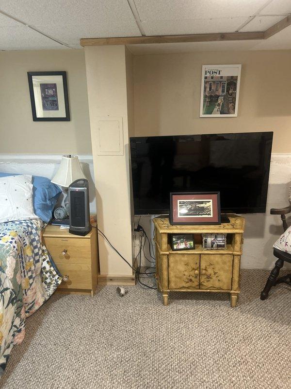 Accessed plumbing system through basement bedroom wall panel to address reported clogged drain issue. Inspected copper piping and drainage components within wall cavity, identified blockage point, and cleared obstruction to restore proper flow. System tested and confirmed operational upon completion.