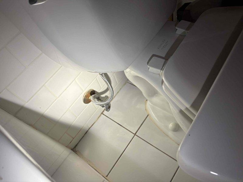 Responded to service call for two toilet issues in residential bathroom. Successfully cleared clog in first toilet using appropriate plumbing tools and techniques to restore proper drainage and flushing function. Inspected second Kohler toilet that was not filling properly and diagnosed issue with fill valve or water supply. Verified chrome braided supply line connection from wall-mounted shutoff valve to tank inlet was secure and functioning. Tested both toilets after repairs to confirm proper operation, adequate water flow, and complete tank filling. All fixtures returned to normal working condition.