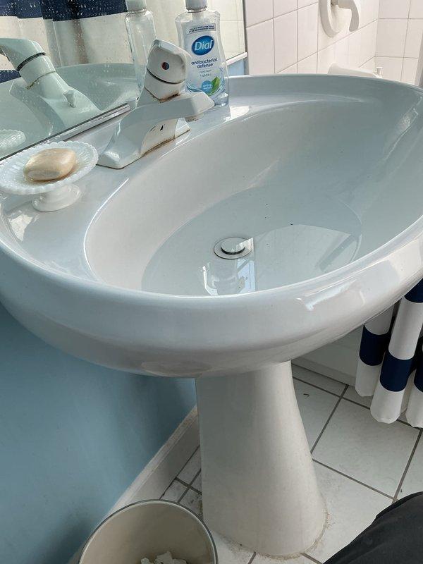 Responded to recurring drain backup issue in kitchen sink approximately one week after initial service call. Upon inspection, assessed garbage disposal unit and associated drain lines beneath sink for blockage or improper drainage. Cleared obstruction from disposal and drain assembly, tested water flow through pedestal bathroom sink and kitchen drainage system to verify proper operation, and confirmed all fixtures draining correctly upon completion.