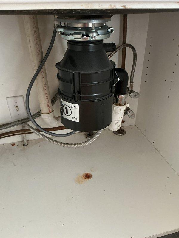 Responded to recurring drain backup issue in kitchen sink approximately one week after initial service call. Upon inspection, assessed garbage disposal unit and associated drain lines beneath sink for blockage or improper drainage. Cleared obstruction from disposal and drain assembly, tested water flow through pedestal bathroom sink and kitchen drainage system to verify proper operation, and confirmed all fixtures draining correctly upon completion.