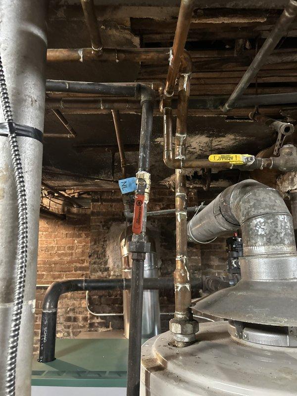 Installed new gas shut-off valve and replaced gas piping in preparation for utility company meter replacement. Work completed in basement utility area with existing infrastructure, ensuring proper valve accessibility and code-compliant pipe connections to facilitate safe gas service interruption and meter swap.