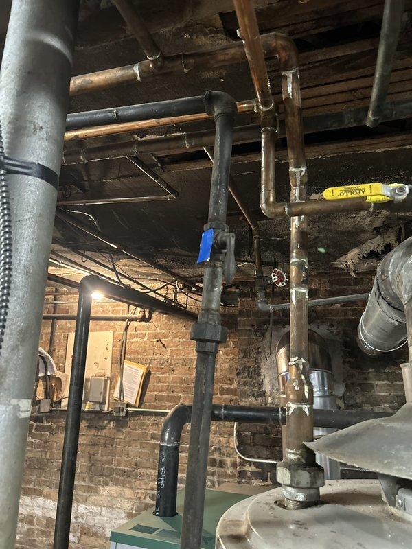 Installed new gas shut-off valve and replaced gas piping in preparation for utility company meter replacement. Work completed in basement utility area with existing infrastructure, ensuring proper valve accessibility and code-compliant pipe connections to facilitate safe gas service interruption and meter swap.