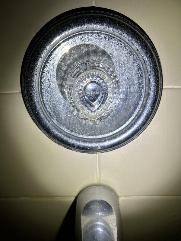 Responded to service call for bathtub faucet with constant dripping issue. Inspected chrome tub faucet and temperature control assembly mounted on tiled shower wall, diagnosed worn internal components causing water leak, and performed necessary repairs to restore proper function and eliminate dripping condition.
