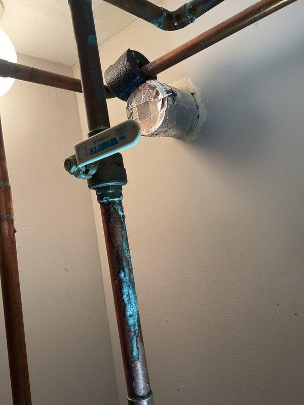 Responded to service call for non-functional water heater and performed on-site evaluation to provide estimate. Upon inspection, documented existing water heater installation showing copper supply line connections at unit top with visible moisture present on tank surface. Observed significant blue-green corrosion on copper piping indicating advanced oxidation and potential leak points in the plumbing system. Photographed plumbing configuration including supply connections, shut-off valves, and pipe routing for estimate documentation. Customer advised that no immediate repair work was requested at this time, estimate only to be provided for water heater replacement and associated plumbing corrections.