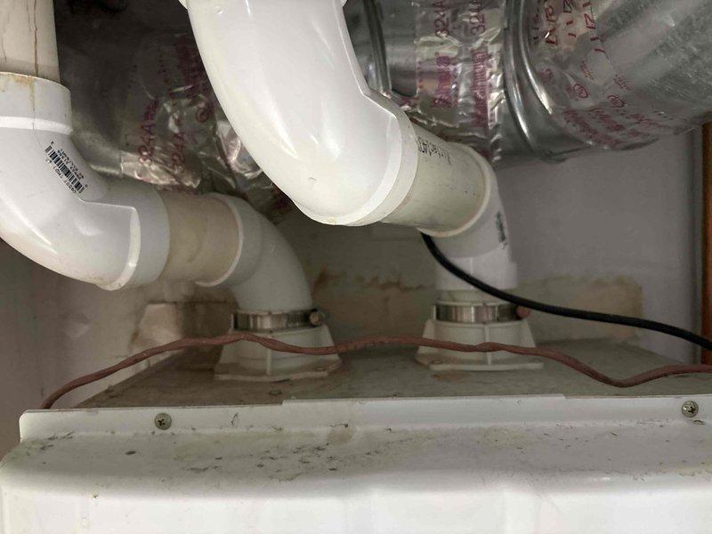 Responded to service call for tankless water heater diagnostics regarding potential sensor or pump malfunction. Inspected unit installation, verified all copper supply line connections, brass fittings, and PVC venting system for proper operation. Assessed water heater mechanical components, checked display panel functionality, and examined plumbing configuration to determine source of reported issue and provided repair quote as requested.