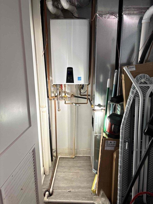 Responded to service call for tankless water heater diagnostics regarding potential sensor or pump malfunction. Inspected unit installation, verified all copper supply line connections, brass fittings, and PVC venting system for proper operation. Assessed water heater mechanical components, checked display panel functionality, and examined plumbing configuration to determine source of reported issue and provided repair quote as requested.