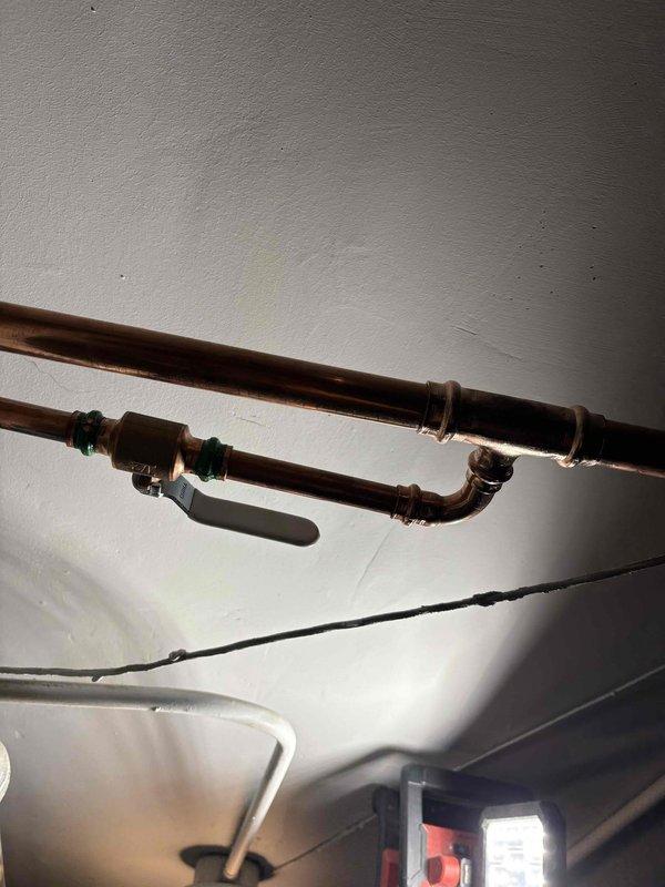 Reconnected boiler system that was previously disconnected during major plumbing work completed approximately one month prior. Verified all copper piping connections, fittings, and valves were properly secured and operational. System tested and confirmed functioning correctly with no leaks detected at connection points.
