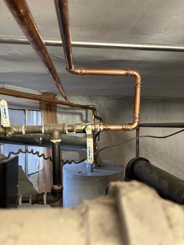 Reconnected boiler system that was previously disconnected during major plumbing work completed approximately one month prior. Verified all copper piping connections, fittings, and valves were properly secured and operational. System tested and confirmed functioning correctly with no leaks detected at connection points.