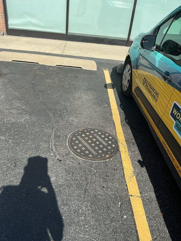 Conducted site assessment for commercial flood control system installation at a property without existing basement infrastructure. Evaluated parking lot drainage conditions and existing infrastructure, including assessment of current drainage covers and asphalt surface conditions. Documented site conditions and provided estimate for full flood control system installation, which may require parking lot excavation to accommodate new drainage infrastructure.
