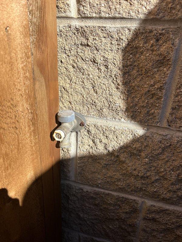 Replaced leaking backyard hose faucet that required interior shutoff to control water flow. Accessed crawl space to install new copper piping with brass fittings and valve assembly, properly secured to floor joists with metal straps. Completed exterior installation with new frost-proof sillcock mounted to exterior wall, restoring full functionality to outdoor water supply without need for manual shutoff.