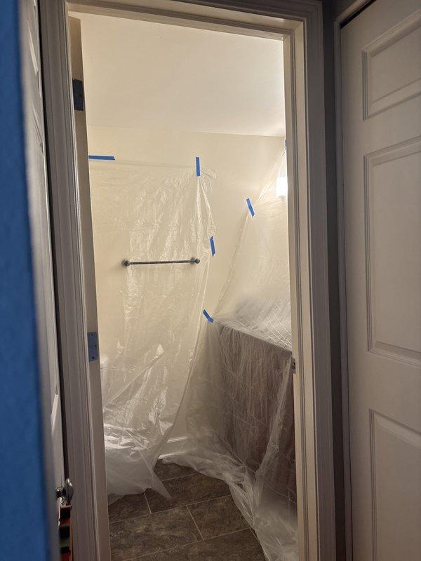 Responded to emergency dispatch for water leak originating from upstairs bathroom and dripping into first-floor bathroom ceiling after toilet flushing. Upon arrival, isolated the source of the leak to a faulty wax ring seal at the base of the upstairs toilet, which was allowing wastewater to seep through the floor assembly during flush cycles. Shut off water supply to the affected fixture and removed the toilet to access the flange and subflooring. Inspected the toilet flange for damage and found it to be intact and properly secured. Removed the deteriorated wax ring and cleaned both the flange surface and toilet base thoroughly. Installed a new reinforced wax ring with integrated polyethylene flange to ensure proper seal. Reinstalled the toilet, torqued closet bolts to manufacturer specifications, and reconnected water supply line. Performed multiple flush tests to verify complete seal and no further leakage. Protected bathroom surfaces with plastic sheeting and painter's tape during 