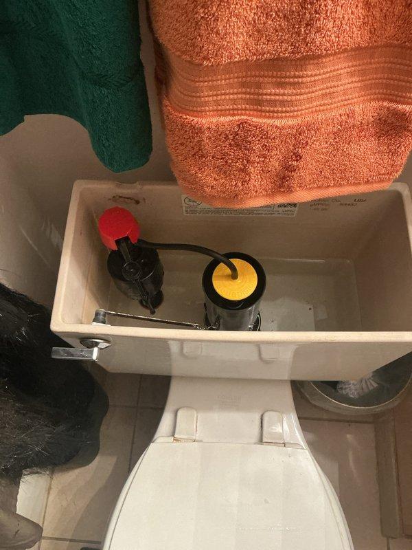 Responded to complaint of constantly running toilet with tank continuously filling. Upon inspection, removed tank lid and diagnosed faulty fill valve assembly preventing proper shutoff. Replaced defective fill valve mechanism with new unit, adjusted float height and water level settings to manufacturer specifications. Tested flush cycle multiple times to verify proper tank filling, automatic shutoff function, and correct water level. Confirmed resolution of running water issue and restored toilet to normal operation.