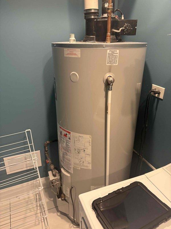 Responded to customer inquiry regarding installation of external gas line hookup for patio grill. Conducted site assessment and documented existing gas water heater installation and utility room configuration to evaluate feasibility of extending gas service. Inspected current gas piping system, connections, and shut-off valves to determine appropriate tie-in point for new exterior gas line installation.