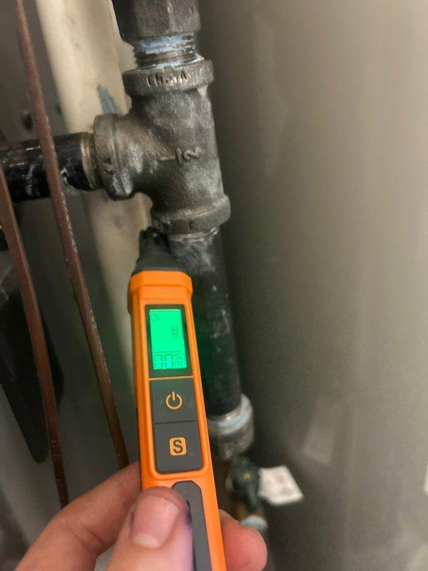 Responded to gas odor complaint at residential property. Upon arrival, performed comprehensive gas leak detection using digital combustible gas detector at suspected piping connections. Identified active gas leak at aging galvanized T-fitting with deteriorated threads and compromised seal integrity. Conducted pressure testing at gas valve assembly and verified leak location. Inspected HVAC equipment gas valve connections and measured electrical continuity to ensure proper system operation. Documented findings with diagnostic equipment readings and photographic evidence of affected components showing oxidation and wear consistent with age-related failure.