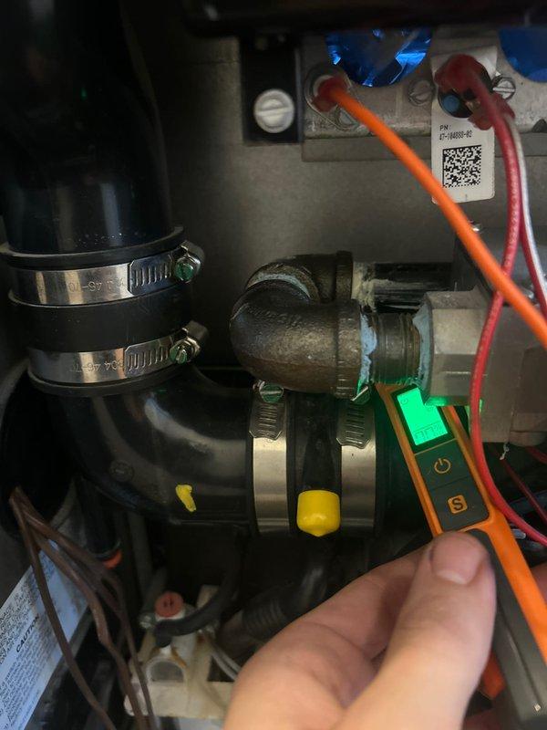 Responded to gas odor complaint at residential property. Upon arrival, performed comprehensive gas leak detection using digital combustible gas detector at suspected piping connections. Identified active gas leak at aging galvanized T-fitting with deteriorated threads and compromised seal integrity. Conducted pressure testing at gas valve assembly and verified leak location. Inspected HVAC equipment gas valve connections and measured electrical continuity to ensure proper system operation. Documented findings with diagnostic equipment readings and photographic evidence of affected components showing oxidation and wear consistent with age-related failure.