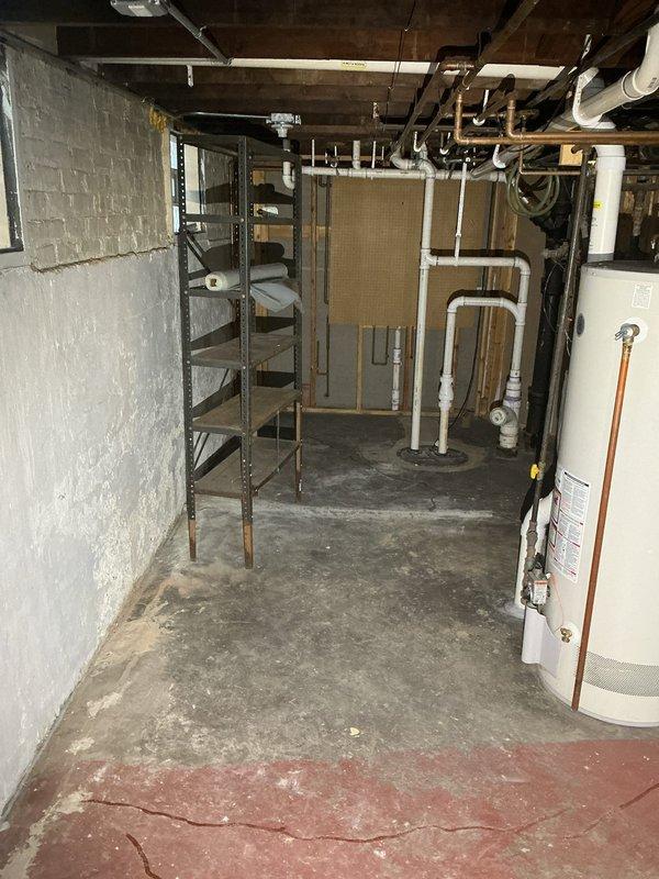 Responded to service call for drain tile estimate at residential property. Upon arrival, conducted thorough inspection of basement utility areas to assess existing drainage conditions and determine scope of work required. Examined basement mechanical room with exposed plumbing systems, including white PVC drainage pipes and various utility connections. Evaluated concrete floor conditions showing moisture staining and wear patterns indicative of potential water intrusion issues. Inspected secondary basement area featuring checkerboard tile flooring and beadboard wall paneling to assess overall drainage needs throughout the space. Photographed existing plumbing infrastructure, floor conditions, and structural elements to document current state and support estimate preparation. Provided comprehensive estimate for drain tile installation to address water management concerns in basement areas.