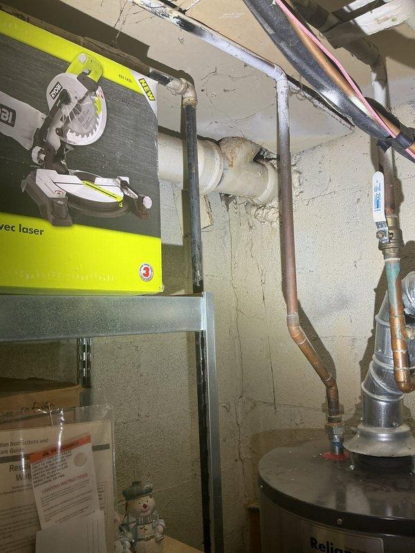 Responded to first-call service appointment at 9AM to assess plumbing system in basement utility area. Upon arrival, conducted comprehensive inspection of existing plumbing infrastructure including water heater installation, supply lines, and drainage systems. Documented current conditions of copper piping, PVC drainage lines, and mechanical connections throughout the utility space. Evaluated water heater unit and associated piping for proper installation and code compliance. Inspected vertical and horizontal pipe runs secured to concrete block walls, verifying bracket and strap mounting integrity. Photographed all plumbing components, electrical panel proximity to water sources, and overall system configuration for service records. Completed assessment of utility room mechanical systems and provided recommendations for necessary repairs or upgrades identified during inspection.