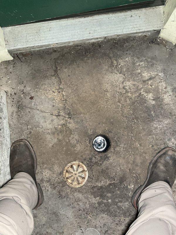 Responded to slow drain complaint at residential property. Upon arrival, inspected floor drainage system in utility area. Located two floor drains embedded in concrete surface showing signs of reduced flow capacity. Performed drain cleaning and clearance procedures on both drainage fixtures to restore proper water flow. Verified drainage operation and confirmed issue resolved with improved drainage performance.