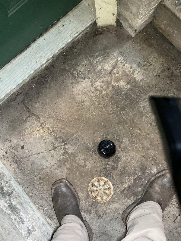 Responded to slow drain complaint at residential property. Upon arrival, inspected floor drainage system in utility area. Located two floor drains embedded in concrete surface showing signs of reduced flow capacity. Performed drain cleaning and clearance procedures on both drainage fixtures to restore proper water flow. Verified drainage operation and confirmed issue resolved with improved drainage performance.
