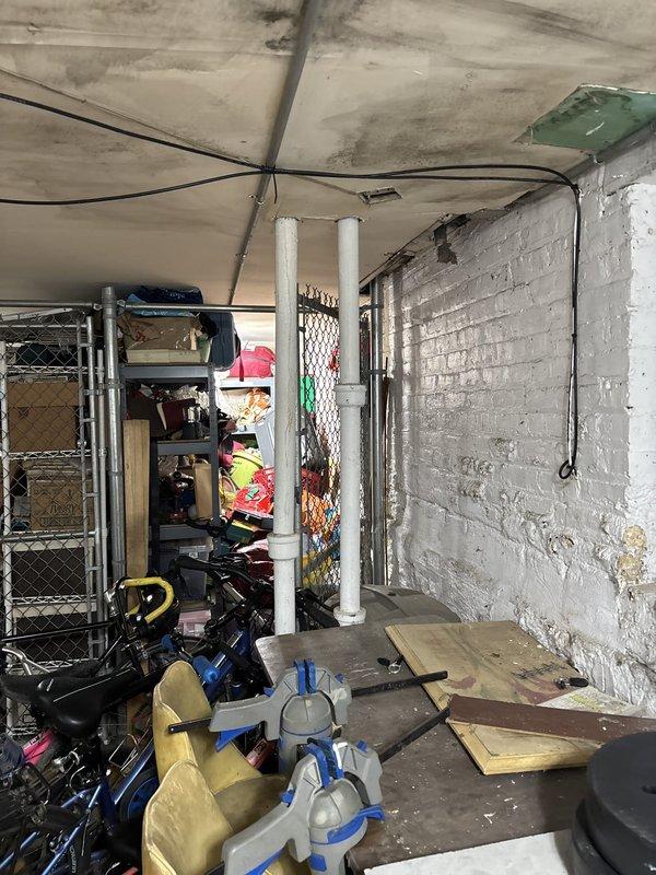 Responded to same-day service call for clogged sink at apartment unit. Upon arrival, accessed building's basement utility area to locate and inspect drainage system. Identified blockage in main drain line serving the affected fixture. Cleared obstruction using appropriate drain cleaning equipment, restored proper water flow, and verified system operation. Documented conditions with photographs for service records.