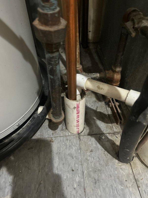 Performed routine maintenance flush on residential tanked water heater. Drained sediment buildup from tank through drain valve, flushed system with fresh water until discharge ran clear, and verified proper operation of temperature and pressure relief valve. Inspected copper supply lines, shut-off valves, and connections for leaks or corrosion—all components found in serviceable condition with no immediate concerns noted.
