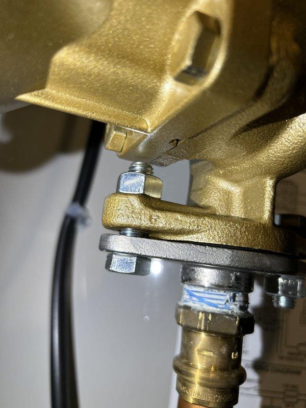 Responded to follow-up service call for persistent oil leakage from building water heater. Inspected recirculation pump assembly and bolt/seal connection at impeller junction point. Evaluated flanged connections, compression fittings, and threaded joints for signs of seepage or compromise. Additionally completed shower diverter valve replacement and toilet wax seal replacement to address independent plumbing concerns in preparation for property sale.