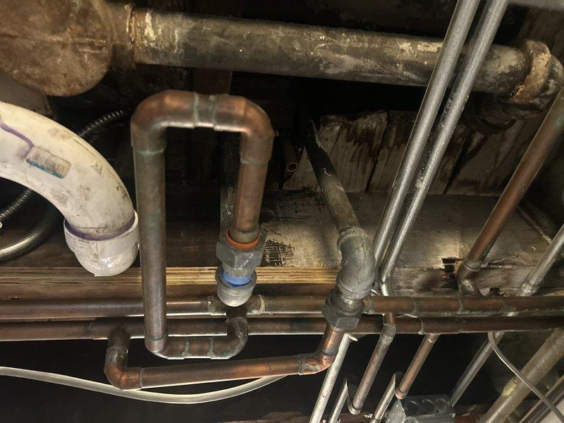 Performed VIP plumbing maintenance including condensate neutralizer service and water heater flush. Inspected under-sink plumbing configuration with supply lines, drain assembly, and shut-off valves, confirming proper operation and connections. Serviced mechanical room plumbing infrastructure including copper trap assembly and PVC drainage system to ensure optimal performance and prevent future issues.