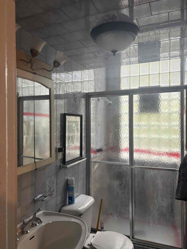 Completed comprehensive plumbing estimate for extensive repiping project in two-bathroom residential property. Documentation included assessment of existing exposed red piping in primary bathroom shower area requiring concealment and proper installation, evaluation of shower enclosure plumbing connections, and analysis of supply line routing for vanity fixtures and pedestal sink applications.