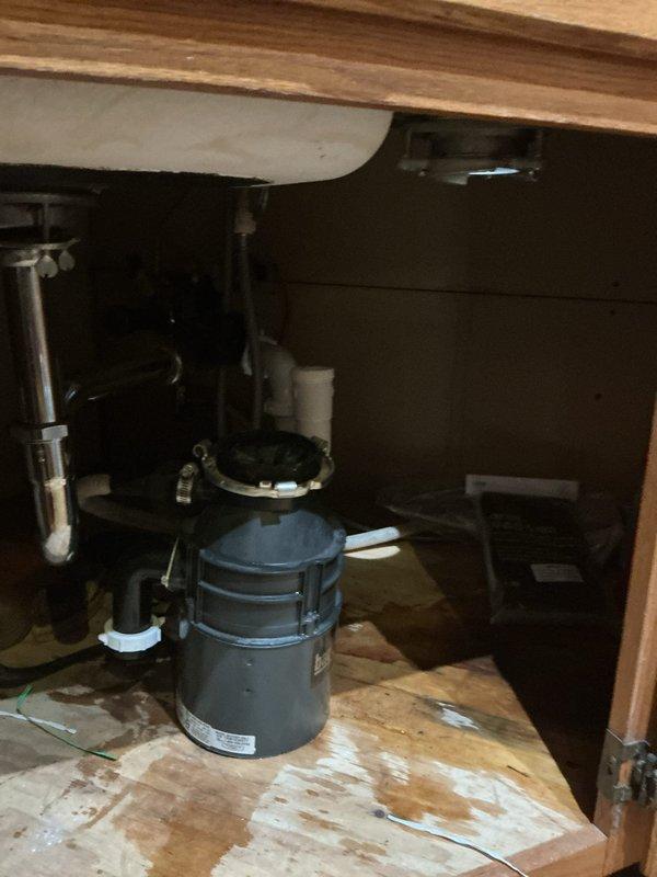 Responded to service call for garbage disposal that had become detached from sink mounting assembly. Upon arrival, inspected under-sink cabinet area and confirmed disposal unit had separated from sink flange connection. Verified disposal unit was intact and undamaged. Cleaned and prepared mounting surfaces, reinstalled garbage disposal to sink flange using proper mounting hardware and gaskets, and torqued mounting ring to manufacturer specifications. Tested unit for proper operation, checked all connections for leaks, and verified secure attachment to sink basin. Unit now functioning properly with no leaks detected.