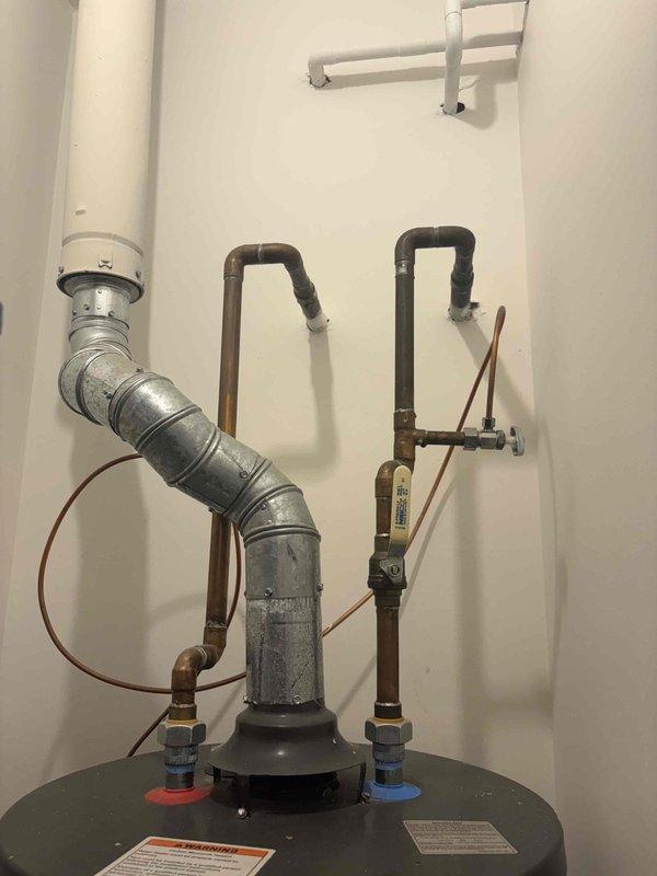 Drained, disconnected, and removed the existing 40-gallon atmospheric gas water heater, hauling it off site, and installed a new 40-gallon Bradford White atmospheric water heater. Reconnected the existing 3/4" copper water piping, 1/2" black iron gas supply, and 3" atmospheric vent piping, and replaced the isolation valve. The existing drain pan was reused, and the unit was started and verified for proper operation, with no leaks observed. Installation is covered by a 6-year parts warranty and a lifetime workmanship warranty.