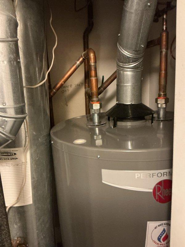 Inspected the reported leak in the garage area, including the exterior hose bib, where staining and discoloration on the surrounding wall indicated prior moisture intrusion, and the water heater connections and supply piping, which showed no visible corrosion, rust, or active damage. Identified the main water shut-off at the water heater for isolation during repairs and documented conditions with photos. Findings were documented for the customer's review, and the work was left pending estimate approval and rescheduling.