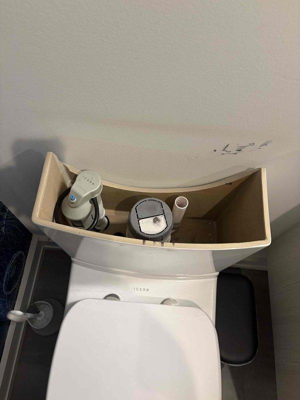 Inspected the toilet tank and found significant mineral deposits, grime buildup on the dual-flush valve buttons, and discoloration throughout the tank interior. The customer has a replacement tank on site but is awaiting delivery of internal components (fill valve and flush assembly), so installation was not completed; the customer will contact the office to reschedule once parts arrive, with a follow-up planned if not received.