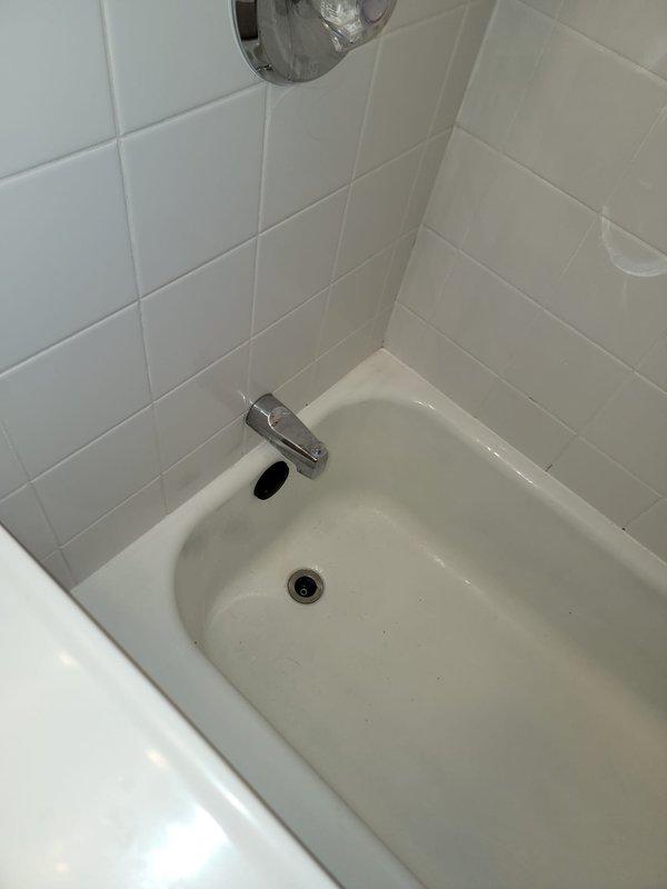 Cleared obstructions from the upstairs toilet and bathtub drain lines using drain cleaning equipment, restoring proper flow and drainage to both fixtures. Inspected the tub spout and addressed the dripping faucet, then tested all fixtures to confirm normal operation with no remaining blockages or leaks.