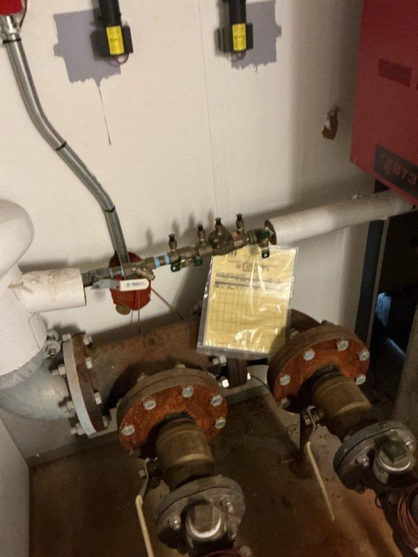 Performed a plumbing estimate for multiple inoperative water refill stations and the installation of two water shut-off valves. Inspected the mechanical room and noted a brass backflow preventer assembly with worn pipe insulation, along with heavily corroded flanged valves and pipe flanges that may require attention. Evaluated the scope of work needed to restore refill station operation and add the shut-offs.