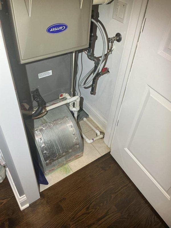 Inspected the second-floor furnace closet floor drain, which was backing up whenever the master bathroom lavatory sink was in use (toilet usage had no effect). Power rodded the floor drain to clear the obstruction and restore proper flow, then tested the floor drain and lavatory drains to verify unobstructed drainage.