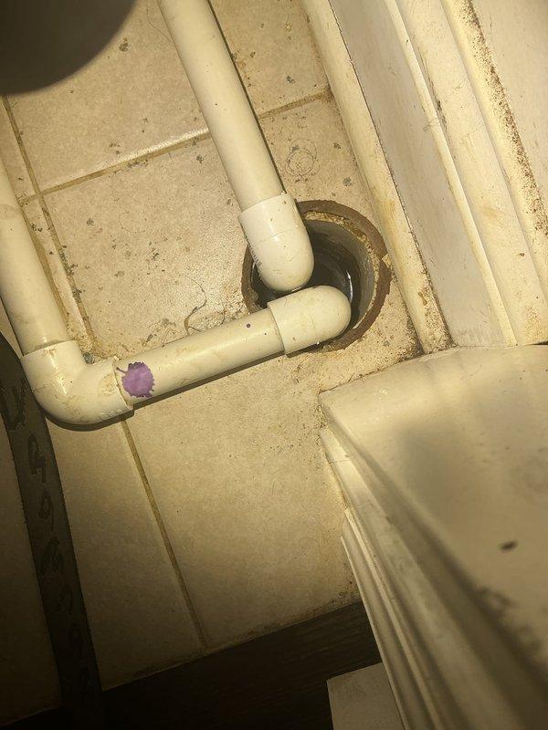 Inspected the second-floor furnace closet floor drain, which was backing up whenever the master bathroom lavatory sink was in use (toilet usage had no effect). Power rodded the floor drain to clear the obstruction and restore proper flow, then tested the floor drain and lavatory drains to verify unobstructed drainage.