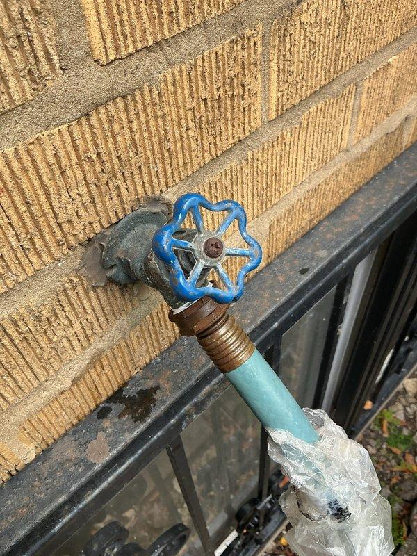 Replaced the corroded bathtub faucet trim, spout, and handle, removing the mineral-encrusted escutcheon and worn diverter components, then resealed the spout-to-wall joint with fresh caulk. Replaced the front and rear exterior hose bibs, removing the deteriorated brass fittings and rusted hose bib assemblies, installing new frost-resistant units, and sealing around the wall penetrations. Tested all fixtures for proper operation and leaks.