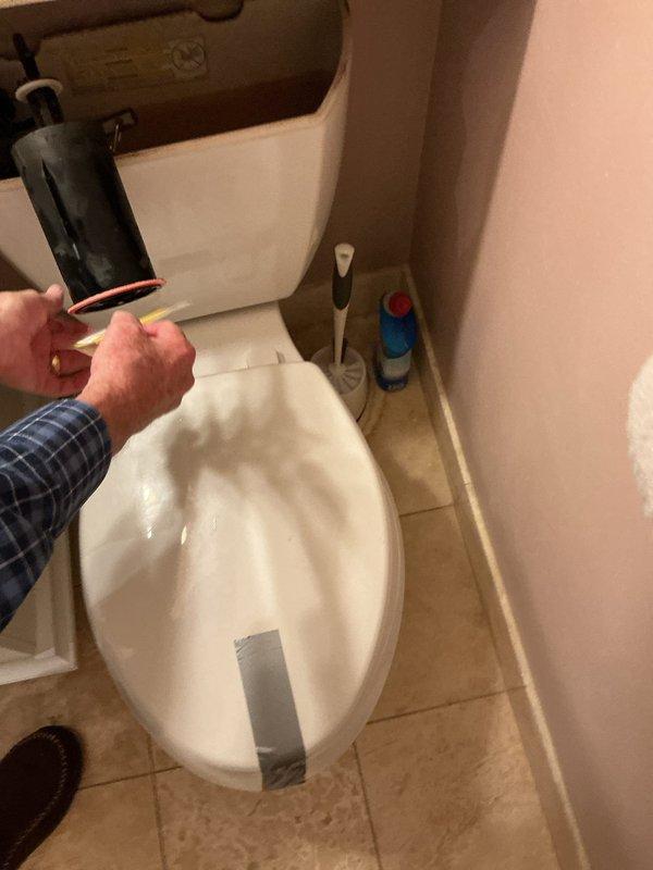 Inspected the toilet and evaluated the existing shut-off valve and fill valve assembly for replacement, using customer-supplied parts. Removed the tank lid to access the internal tank components and assessed the fill valve and flapper/float assembly to determine the scope of work. Prepared an estimate for replacing the toilet shut-off valve and fill valve, with the work coordinated around the building's scheduled water shutoff.