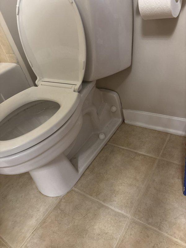 Repaired a water leak at the toilet supply connection by addressing the compression nut fitting at the angle stop valve; the supply line and valve were inspected and the connection was re-secured and leak-tested. Confirmed no leakage from the tank or supply line, and the connection is now dry and functioning properly.