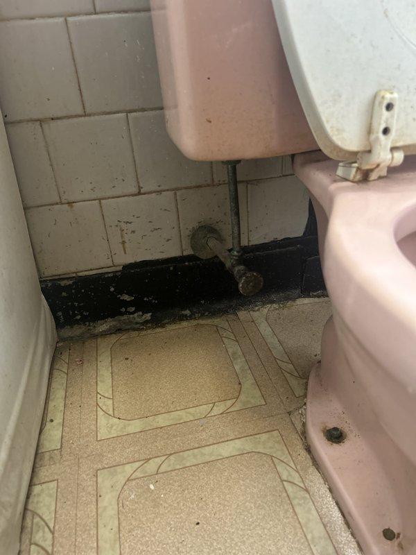 Installed a high-performance toilet on the first floor, inspecting the existing fixture connections and noting heavily corroded supply stop valve and escutcheon during the work. Flushed and drained the water heater tank to remove sediment buildup and restore efficiency.