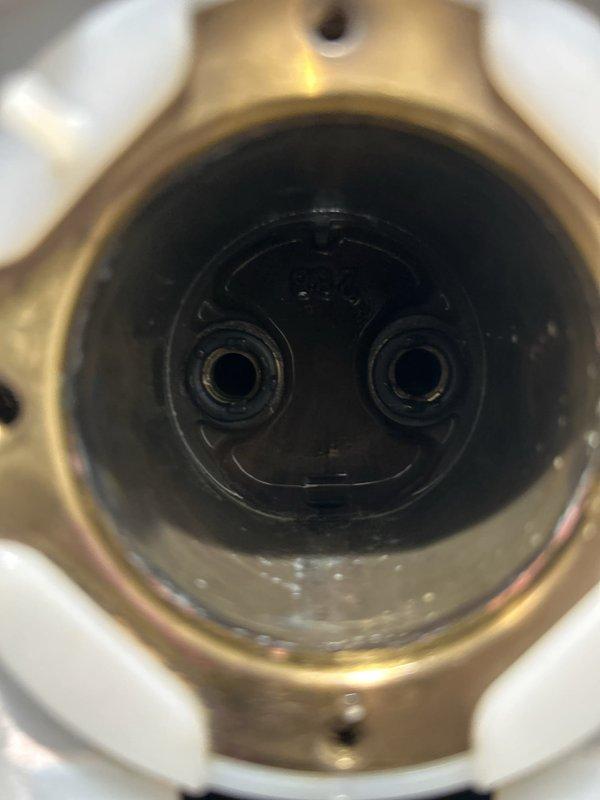 Removed the shower valve trim and handle to access the valve body, then replaced the worn cartridge and gaskets to eliminate the leak at the shower valve. Inspected the valve cavity and surrounding fixture for moisture and mineral buildup, and reassembled the trim and handle. Evaluated the reported ceiling leaks below the shower as potentially related to the shower valve leak and recommended further inspection of the shower drain and supply connections if staining or moisture persists.
