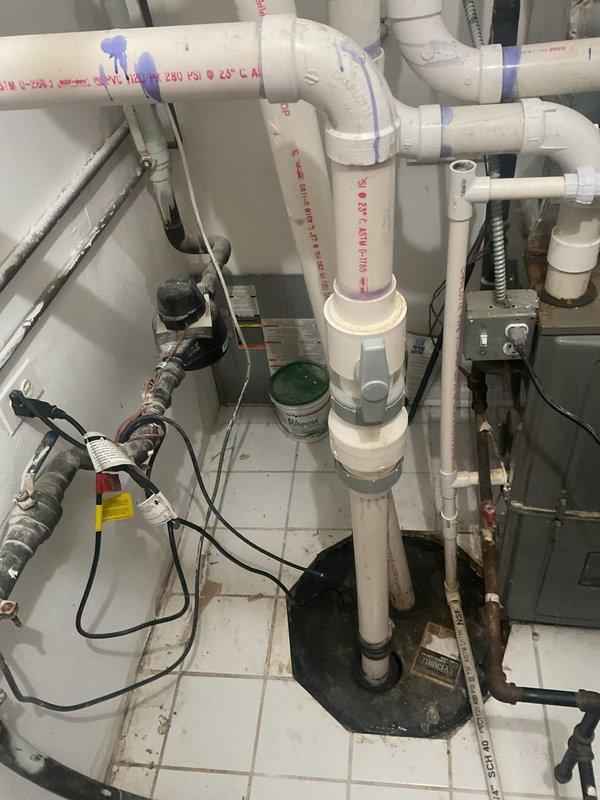Removed and disposed of the existing Everbilt ejector pump, then installed a new Zoeller grinder pump with a new check valve in the sewage basin. Resealed the pit lid and performed a full operational test to confirm proper pump cycling and discharge. Installation is backed by a lifetime workmanship warranty and a 3-year parts warranty.