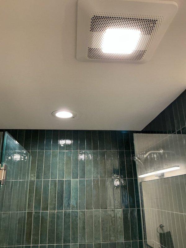 Completed the sold plumbing repair in the shower area, which required a helper and extension ladder for overhead access. Inspected the shower drain, which was missing its cover and showed heavy mineral buildup, debris, and minor surface rust around the drain ring, and verified that the surrounding glass enclosure, tile, and ceiling fixtures were undamaged.
