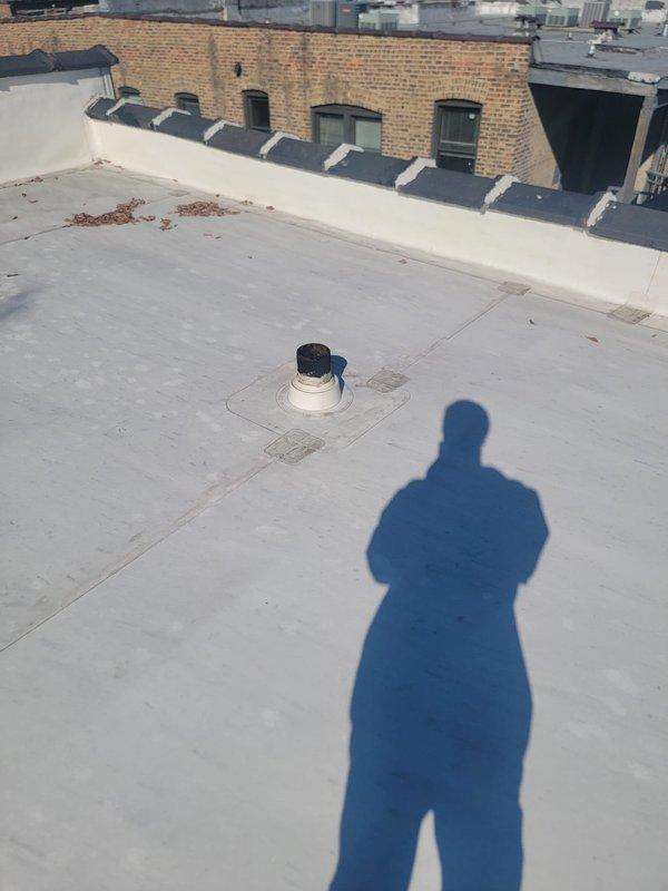 Performed annual preventive maintenance on the building's main drain stack, accessing the roof to inspect the vent penetrations and flashing boots and to clear dried leaves and debris from around the vent terminations and parapet base. Rodded the stack from the roof access point to remove buildup and verify an unobstructed flow path through the main line, leaving the system clear and operating properly.