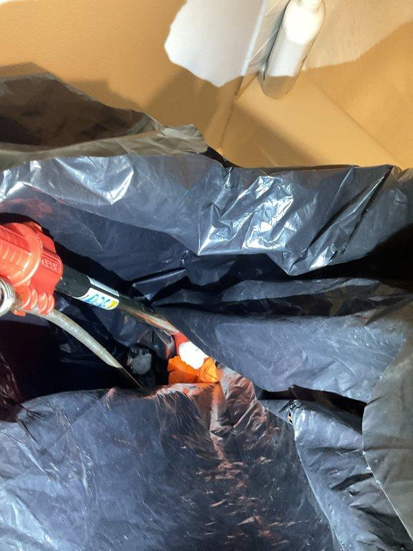 Responded to a main sewer line backup affecting two toilets and a bathtub, with sewage surfacing through the fixtures. Protected the work area with plastic sheeting, accessed the main line cleanout, and ran a drain machine with cable to clear the blockage and restore full flow. Flushed fixtures to confirm proper drainage, with water now draining freely and no further backup observed.