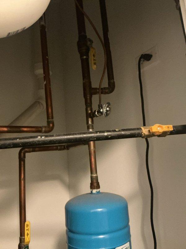 Performed an on-site estimate for installation of a utility sink in the laundry room, assessing the available wall space and nearby plumbing. Verified an existing floor drain and recessed supply box in the laundry area, and inspected the adjacent mechanical closet, noting accessible copper supply lines with isolation valves, an expansion tank, and PVC drain piping that can serve as tie-in points. No leaks, active corrosion, or damage were observed, and photos were documented for the quote.